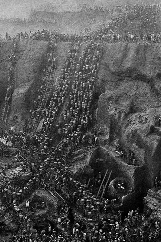 Thousands of miners clambering through mud pits of Serra Pelada, Brazil